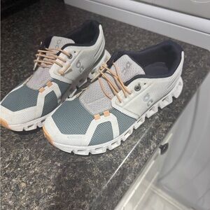 On Running White and Tan Sneakers